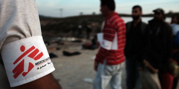 SIKAMINIAS, GREECE - OCTOBER 16: Recently arrived migrants line up for buses provided by the medical charity Doctors Without Borders after arriving from Turkey onto the island of Lesbos on October 16, 2015 in Sikaminias, Greece. Dozens of rafts and boats are still making the journey daily as thousands flee conflict in Iraq, Syria, Afghanistan and other countries. More than 500,000 migrants have entered Europe so far this year. Of that number four-fifths of have paid to be smuggled by sea to Greece from Turkey, the main transit route into the EU. Nearly all of those entering Greece on a boat from Turkey are from the war zones of Syria, Iraq and Afghanistan. (Photo by Spencer Platt/Getty Images)