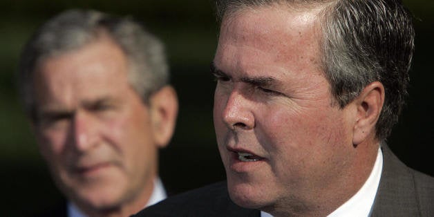 Washington, UNITED STATES: US President George W. Bush (L) looks on as his brother Florida Governor Jeb Bush speaks 19 April, 2006. Governor Bush was among several governors who met with the president after an Easter trip to Iraq, Afghanistan and Kuwait. AFP PHOTO/Jim WATSON (Photo credit should read JIM WATSON/AFP/Getty Images)