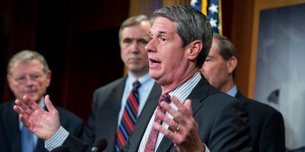 UNITED STATES - MAY 7: Sen. David Vitter, R-La., speaks as, from left, Sens. James Inhofe, R-Okla., Jeff Merkley, D-Ore., and Tom Udall, D-N.M., look on, during a news conference in the Capitol's Senate studio on the Chemical Safety Improvement Act, May 7, 2015. (Photo By Tom Williams/CQ Roll Call)