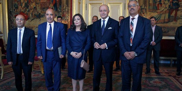 PARIS, FRANCE - OCTOBER 15: (L-R) Tunisian lawyer Fadhel Mahfoudh, Abdessatar Ben Moussa, Head of Tunisan Human Rights League (LTDH), Wided Bouchamaoui, Tunisian Confederation of Industry, Trade and Handicrafts (UTICA), French Foreign Minister Laurent Fabius and Samir Cheffi, Deputy Secretary of the Tunisian General Labour Union (UGTT), pose for a photo at the Quai d'Orsay on October 15, 2015 in Paris, France. Tunisia's National Dialogue Quartet won the Nobel Peace Prize for helping build democracy in the birthplace of the Arab Spring. (Photo by Chesnot/Getty Images)