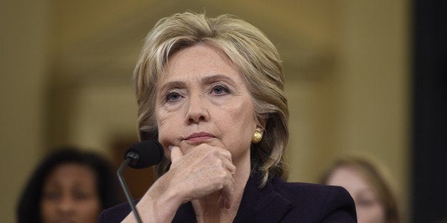 Former Secretary of State and Democratic Presidential hopeful Hillary Clinton testifies before the House Select Committee on Benghazi on Capitol Hill in Washington, DC, October 22, 2015. Clinton took the stand Thursday to defend her role in responding to deadly attacks on the US mission in Libya, as Republicans forged ahead with an inquiry criticized as partisan anti-Clinton propaganda. AFP PHOTO / SAUL LOEB (Photo credit should read SAUL LOEB/AFP/Getty Images)