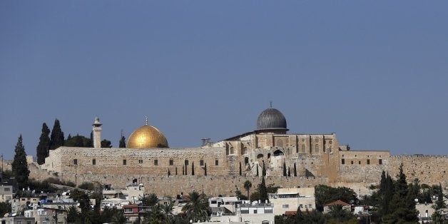 A picture taken on October 15, 2015 shows the Dome of the Rock mosque (golden dome) and al-Aqsa Mosque (silver dome) at the al-Aqsa Mosque compound in Jerusalem's Old City. Israeli security forces deployed massively in Jerusalem as Jews armed themselves with everything from guns to broomsticks, rattled by a wave of Palestinian attacks that have shaken the country. AFP PHOTO / AHMAD GHARABLI (Photo credit should read AHMAD GHARABLI/AFP/Getty Images)