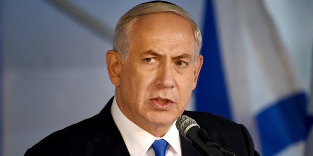 Israeli Prime Minister Benjamin Netanyahu speaks during the official memorial ceremony marking the 20th anniversary of the assassination of the late Prime Minister Yitzhak Rabin in the Mt. Herzl Cemetery in Jerusalem, Israel, Monday, Oct. 26, 2015. (Debbie Hill/Pool Photo via AP)