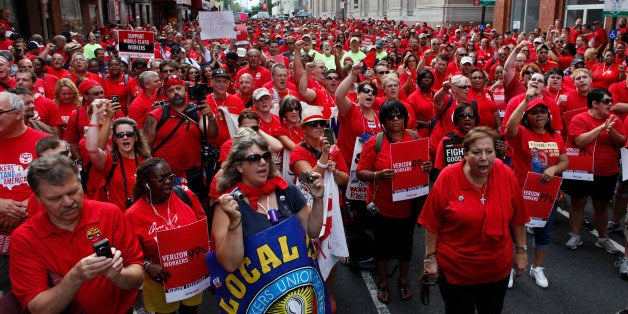 Members of the Communications Workers of America (CWA) participate in a demonstration, Saturday Aug. 11, 2012, outside Verizon's offices in Philadelphia. Thousands of union members are expected to rally in support for a second bill of rights for the American worker, organizers of "Workers Stand for America" say they expect upward of 20,000 people to attend the all-day event in Philadelphia. (AP Photo/ Joseph Kaczmarek)