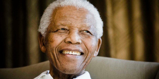 FILE - In this Tuesday, June 2, 2009 file photo, former South African President Nelson Mandela reacts at the Mandela foundati