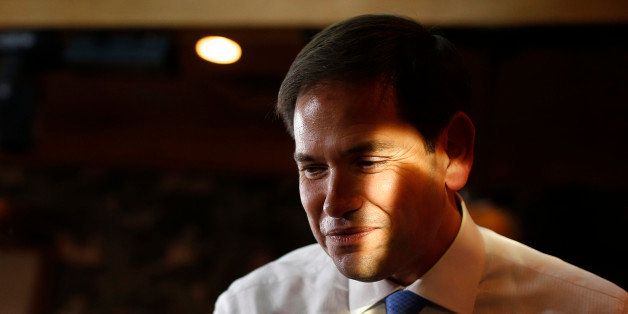 Sunlight illuminates Republican presidential candidate, Sen. Marco Rubio, R-Fla., during an event at a restaurant Friday, Oct. 9, 2015, in Las Vegas. Rubio is scheduled to attend events in the Las Vegas area through Saturday. (AP Photo/John Locher)