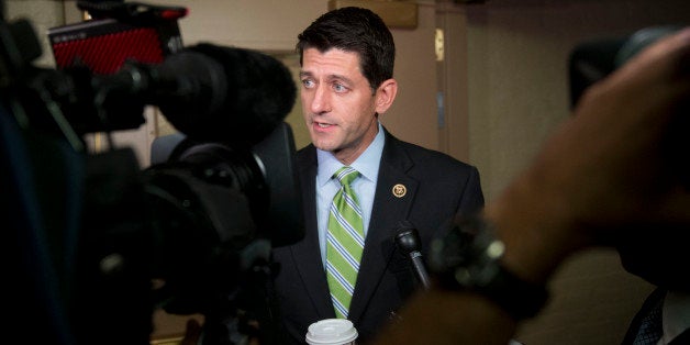 Representative Paul Ryan, a Republican from Wisconsin and chairman of the House Ways and Means Committee, speaks to members o