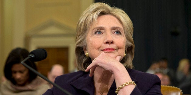 Democratic presidential candidate and former Secretary of State Hillary Rodham Clinton, listens as she testifies on Capitol H