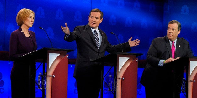 Ted Cruz, center, talks about the mainstream media as Carly Fiorina, left, and Chris Christie look on during the CNBC Republi