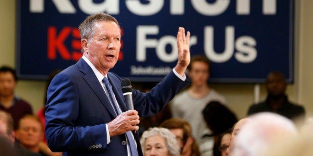 Republican presidential candidate, Ohio Gov. John Kasich gestures during a town hall meeting at the University of Richmond in