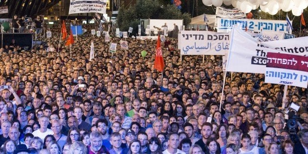 A general view shows people attending a commemorative rally in memory of late Israeli prime minister Yitzhak Rabin, at Rabin