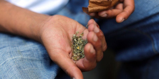 NEW YORK, NY - AUGUST 05: A man prepares to smoke K2 or 'Spice', a synthetic marijuana drug, along a street in East Harlem on August 5, 2015 in New York City. New York, along with other cities, is experiencing a deadly epidemic of synthetic marijuana usage including varieties known as K2 or 'Spice' which can cause extreme reactions in some users. According to New York's health department, more than 120 people visited an emergency room in the city in just one week in April. While the state banned the ingredients used to make K2 in 2012, distributors have switched to other ingredients and names in an attempt to circumvent the law. (Photo by Spencer Platt/Getty Images)