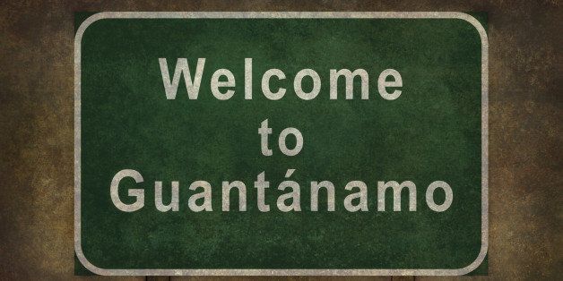 Welcome to Guantanamo road sign illustration with distressed ominous background.