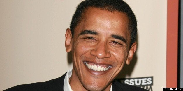 barack obama signing copies of...