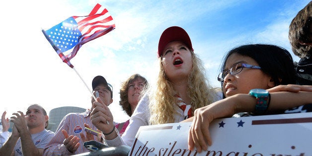 NORFOLK, VA - OCTOBER 31: Donald Trump supporters cheer for the Republican presidential while he speaks at a rally in front