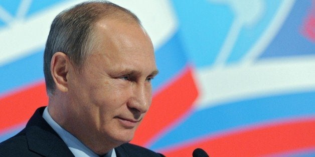 Russian President Vladimir Putin delivers a speech at the 5th World Congress of Compatriots Living Abroad in Moscow on Novemb