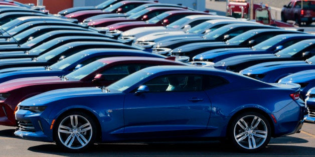 2016 Chevrolet Camaros sit parked outside before being shipped to dealers from the General Motors Co. (GM) Lansing Grand River Assembly plant in Lansing, Michigan, U.S., on Monday, Oct. 26, 2015. General Motors Co. and the United Auto Workers reached a tentative four-year agreement that is expected to provide raises across the board, averting a potential strike. Photographer: Jeff Kowalsky/Bloomberg via Getty Images