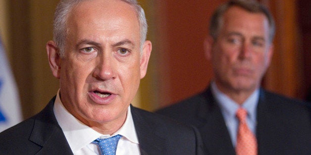 House Speaker John Boehner of Ohio looks on at right as Israeli Prime Minister Benjamin Netanyahu makes a statement on Capitol Hill in Washington, Tuesday, May 24, 2011. (AP Photo/Evan Vucci)