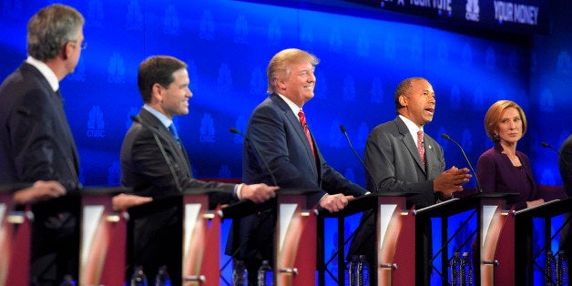 Ben Carson, second from right, speaks, as Jeb Bush, left, Marco Rubio, second from left, Donald Trump, center, and Carly Fior