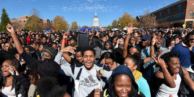 Student protesters on the campus of the University of Missouri in Columbia react to news of the resignation of University of Missouri system President Tim Wolfe on Monday, Nov. 9, 2015. Wolfe resigned under pressure from student protesters who claimed the president had not done enough to address recent racially-motivated incidents on the campus. (David Eulitt/Kansas City Star/TNS via Getty Images)