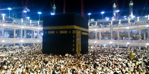 Picture of the Kaaba and a group of pilgrims they walk around to perform Hajj or Umrah, and all Muslims follow its, Located in Mecca in Saudi Arabia.