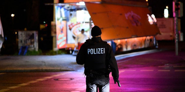 HANOVER, GERMANY - NOVEMBER 17: Police forces secure a scene at Robert-Enke-Strasse after finding a suspicious piece of luggage prior the match Germany against the Netherlands at the HDI-Arena on November 17, 2015 in Hanover, Germany. The German Federal Police raised the number of heavy equipped Police officers inside the main train station of Hanover, the airport of Hanover as well as at the HDI-Arena in order to increase the safety, after the attacks in Paris last week. German chancellor Angela Merkel (CDU) and members of the German Federal cabinet are expected to be among the guests at the match. (Photo by Alexander Koerner/Getty Images)