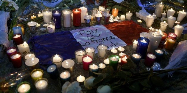 View of candles and flowers outside the French embassy building in Mexico City on November 16, 2015, in solidarity with the victims of Paris' attacks. A total of 129 people died and 352 were injured in the November 13 attacks in Paris in what for now is only 'a temporary' toll, Paris prosecutor said. AFP PHOTO / ALFREDO ESTRELLA (Photo credit should read ALFREDO ESTRELLA/AFP/Getty Images)