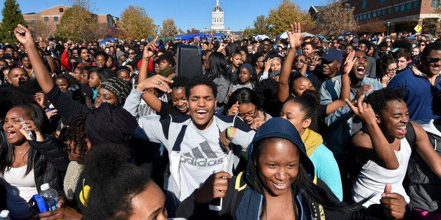 Student protesters on the campus of the University of Missouri in Columbia react to news of the resignation of University of Missouri system President Tim Wolfe on Monday, Nov. 9, 2015. Wolfe resigned under pressure from student protesters who claimed the president had not done enough to address recent racially-motivated incidents on the campus. (David Eulitt/Kansas City Star/TNS via Getty Images)