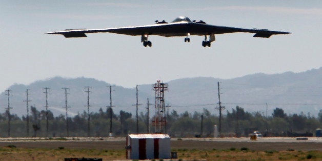 PALMDALE, CA JULY 17, 2014 -- The U.S. Air Force's B-2 Spirit Stealth bomber 'Spirit of Arizona' lands at the Northrop Grumman Corp. facility at U.S. Air Force Plant 42 in Palmdale on July 17, 2014 as Northrop Grumman hosts the 25th anniversary celebration of the first flight in the same location at the Palmdale Aircraft Integration Center of Excellence at U.S. Air Force Plant 42. Just as they had on that historic day 25 years ago, several hundred Northrop Grumman employees, civic leaders and Air Force personnel stood along the fence line in Palmdale to watch a B-2 stealth bomber taxi onto the runway for flight following the ceremony. (Photo by Al Seib/Los Angeles Times via Getty Images)