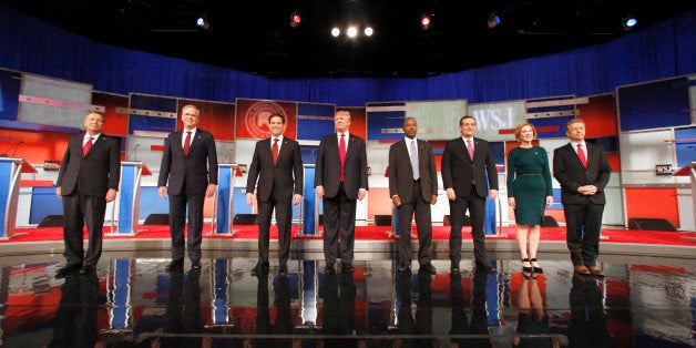 Republican presidential candidates John Kasich, Jeb Bush, Marco Rubio, Donald Trump, Ben Carson, Ted Cruz, Carly Fiorina and Rand Paul take the stage before the Republican presidential debate at the Milwaukee Theatre, Tuesday, Nov. 10, 2015, in Milwaukee. (AP Photo/Jeffrey Phelps)