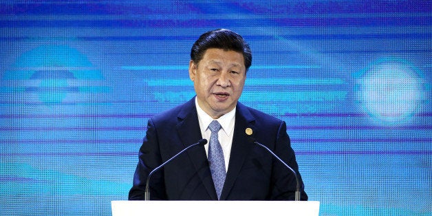 Xi Jinping, China's president, speaks at the Asia-Pacific Economic Cooperation (APEC) CEO Summit in Manila, the Philippines, on Wednesday, Nov. 18, 2015. Xi acknowledged downside risks to growth while assuring fellow leaders that Asia's biggest economy is resilient and will remain on the path of reform. Photographer: SeongJoon Cho/Bloomberg via Getty Images 