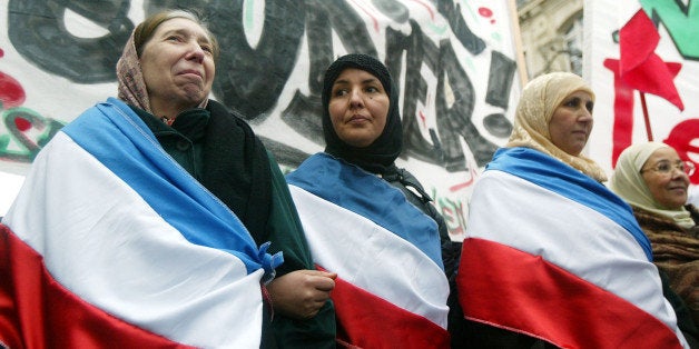 PARIS - JANUARY 17: Muslim women demonstrate against the French proposal to bar Muslim women from wearing headscarves in sta