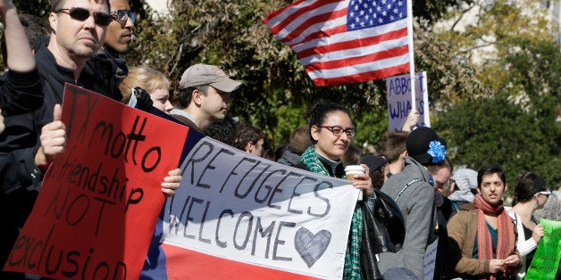 AUSTIN, TX - NOVEMBER 22: Members of The Syrian People Solidarity Group protest on November 22, 2015 in Austin, Texas. The group was protesting Texas governor Greg Abbott's refusal to allow Syrian refugees in the state. (Photo by Erich Schlegel/Getty Images)