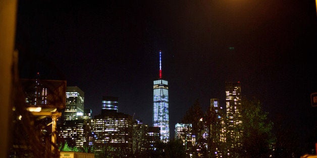 The One World Trade Center spire is lit blue, white and red after New York Gov. Andrew Cuomo announced the lighting in honor