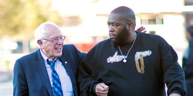 Democratic presidential candidate Sen. Bernie Sanders, I-Vt. left, walks in with rapper Killer Mike for a visit to The Busy Bee Cafe Monday, Nov. 23, 2015, in Atlanta. (AP Photo/David Goldman)