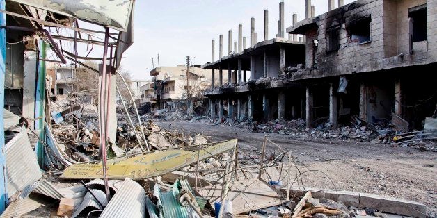 This Nov. 19, 2014 photo shows what remains of Kobani, Syria, after fighting between Islamic State militants and Kurdish fighters and coalition airstrikes. (AP Photo/Jake Simkin)