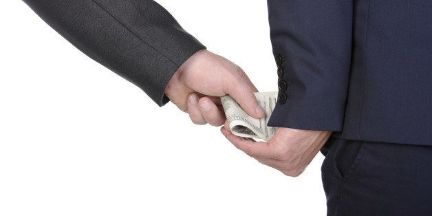 Man gently takes a bribe isolated on white background