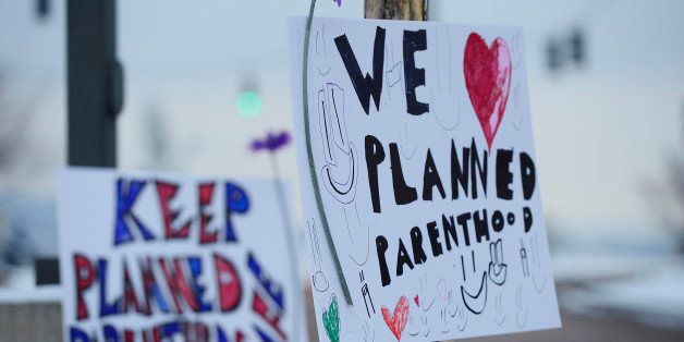 COLORADO SPRINGS, CO - NOVEMBER 29: Signs in support of Planned Parenthood at Fillmore Street and Centennial Boulevard on November 29, 2015 in Colorado Springs, Colorado. The investigation moves into its third day after a gunman attacked a Planned Parenthood, killing three and injuring nine. (Photo by Brent Lewis/The Denver Post via Getty Images)