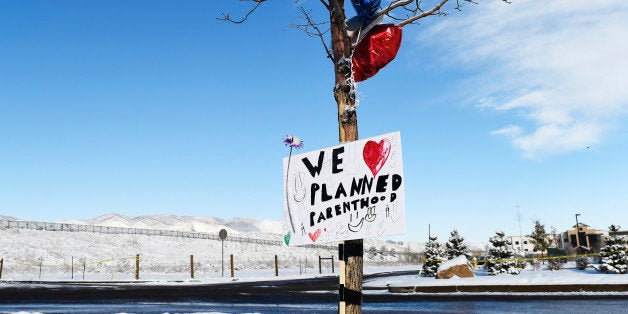 COLORADO SPRINGS, CO - NOVEMBER 30: A sign supporting Planned Parenthood hangs near the entrance of the Planned Parenthood fa