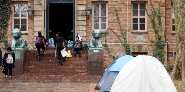 Tents are erected outside of Princeton University's Nassau Hall, where students are staging a sit-in, Thursday, Nov. 19, 2015, in Princeton, N.J. The protesters from a group called the Black Justice League, who staged a sit-in inside university President Christopher Eisgruber's office on Tuesday, demand the school remove the name of former school president and U.S. President Woodrow Wilson from programs and buildings over what they said was his racist legacy. (AP Photo/Julio Cortez)