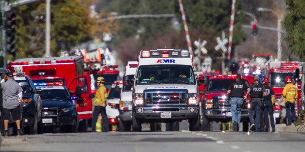 SAN BERNARDINO, CA - DECEMBER 2: Ambulances leave the scene of a mass shooting at the Inland Regional Center on December 2,