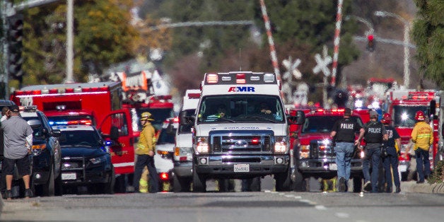 SAN BERNARDINO, CA - DECEMBER 2: Ambulances leave the scene of a mass shooting at the Inland Regional Center on December 2, 2105 in San Bernardino, California. Multiple fatalities and injuries were reported as police search for up to three suspects who are still at-large. (Photo by Gina Ferazzi / Los Angeles Times via Getty Images)