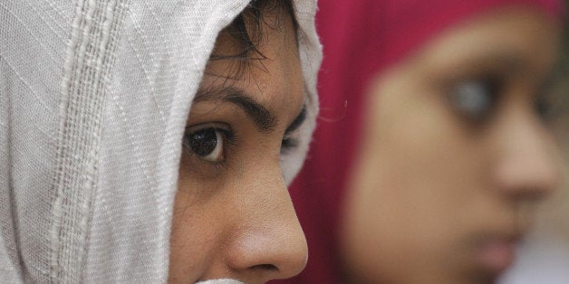 Sahar Khan, left, and Rimshah Hussain, right, both of Newington, gather with Muslims and people of other faiths at the Capitol in Hartford, Conn., to discuss what they call "Islamophobia" across the country and concerns for their safety during the holy month of Ramadan, Friday, Aug. 13, 2010. (AP Photo/Jessica Hill)