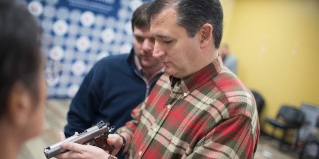 JOHNSTON, IA - DECEMBER 04: Republican presidential candidate Sen. Ted Cruz (R-TX) looks over a handgun handed to him by a supporter during a campaign event at CrossRoads Shooting Sports gun shop and range on December 4, 2015 in Johnston, Iowa. A recent poll had Cruz tied for third place with Ben Carson and behind Sen. Marco Rubio (R-FL) and front runner Donald Trump in the race for the Republican presidential nomination. (Photo by Scott Olson/Getty Images)