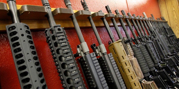 FILE - In this July 20, 2012, file photo, a row of different AR-15 style rifles are displayed for sale at the Firing-Line indoor range and gun shop in Aurora, Colo. After a steady string of mass shootings and a revival of the political fight over gun control, Americans are slightly more likely than they were two years ago, in 2013, to say gun laws should be made stricter, a new Associated Press-GfK poll found. (AP Photo/Alex Brandon, File)