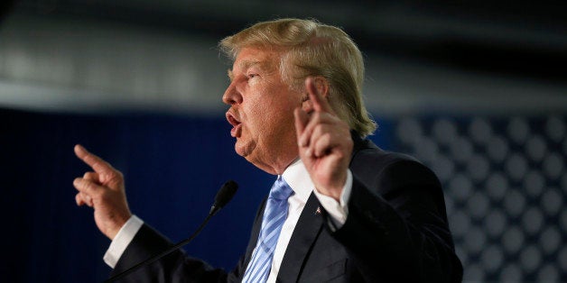 Republican presidential candidate Donald Trump speaks during a campaign rally Saturday, Dec. 5, 2015, in Davenport, Iowa. (AP Photo/Charlie Neibergall)