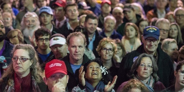 MT. PLEASANT, SC - DECEMBER 7: People watch a monitor inside the venue while Republican presidential candidate Donald Trump speaks to the crowd at a Pearl Harbor Day Rally At U.S.S. Yorktown December 7, 2015 in Mt. Pleasant, South Carolina. The South Carolina Republican primary is scheduled for February 20, 2016. (Photo by Sean Rayford/Getty Images)