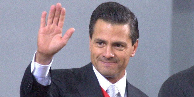 MEXICO CITY, MEXICO - SEPTEMBER 02: Mexican president Enrique Peña Nieto waves during the Presentation of Second Anual Report of Mexican Federal Government at National Palace on September 02, 2014 in Mexico City, Mexico. (Photo by Miguel Tovar/ LatinContent/Getty Images)