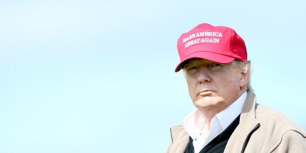 Presidential contender Donald Trump looks on at the 16th green on the 1st first day of the Women's British Open golf championship on the Turnberry golf course in Turnberry, Scotland, Thursday, July 30, 2015. (AP Photo/Scott Heppell)