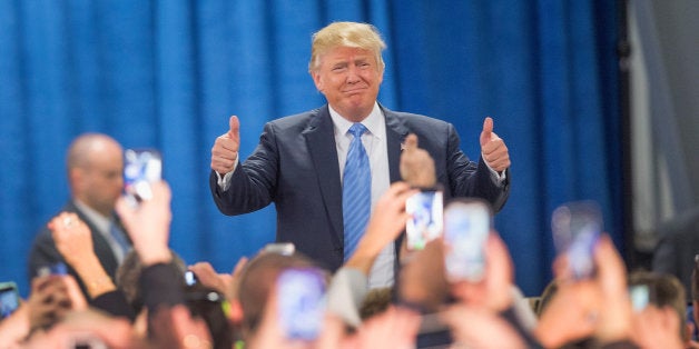 DAVENPORT, IA - DECEMBER 05: Republican presidential candidate Donald Trump arrives for a campaign event at Mississippi Valley Fairgrounds on December 5, 2015 in Davenport, Iowa. Trump continues to lead the most polls in the race for the Republican nomination for president. (Photo by Scott Olson/Getty Images)